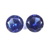 Pair of loose circular cut synthetic sapphires.