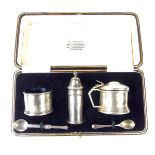 A George V silver three piece condiment set.