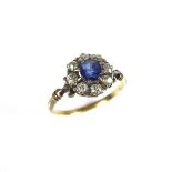 Sapphire and diamond flower cluster ring.