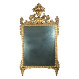 A French Louis XVI gilt wood wall mirror, probably late 18th century.