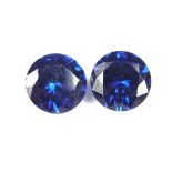 Pair of loose circular cut synthetic sapphires.