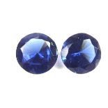 Pair of loose circular cut synthetic sapphires.