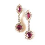 Pair of ruby and diamond pendant earrings.