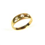 18 ct yellow gold three stone diamond ring.