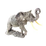 A large sterling silver model of an elephant.