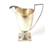 A George V silver milk jug.