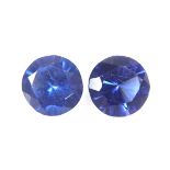 Pair of loose circular cut synthetic sapphires.