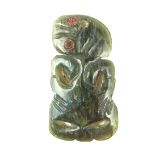 Tribal Art: A Maori carved jade tiki hei pendant, New Zealand, probably late19th/early 20th century.