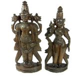 A modern pair of Indian carved wood Hindu deities, 20th century.