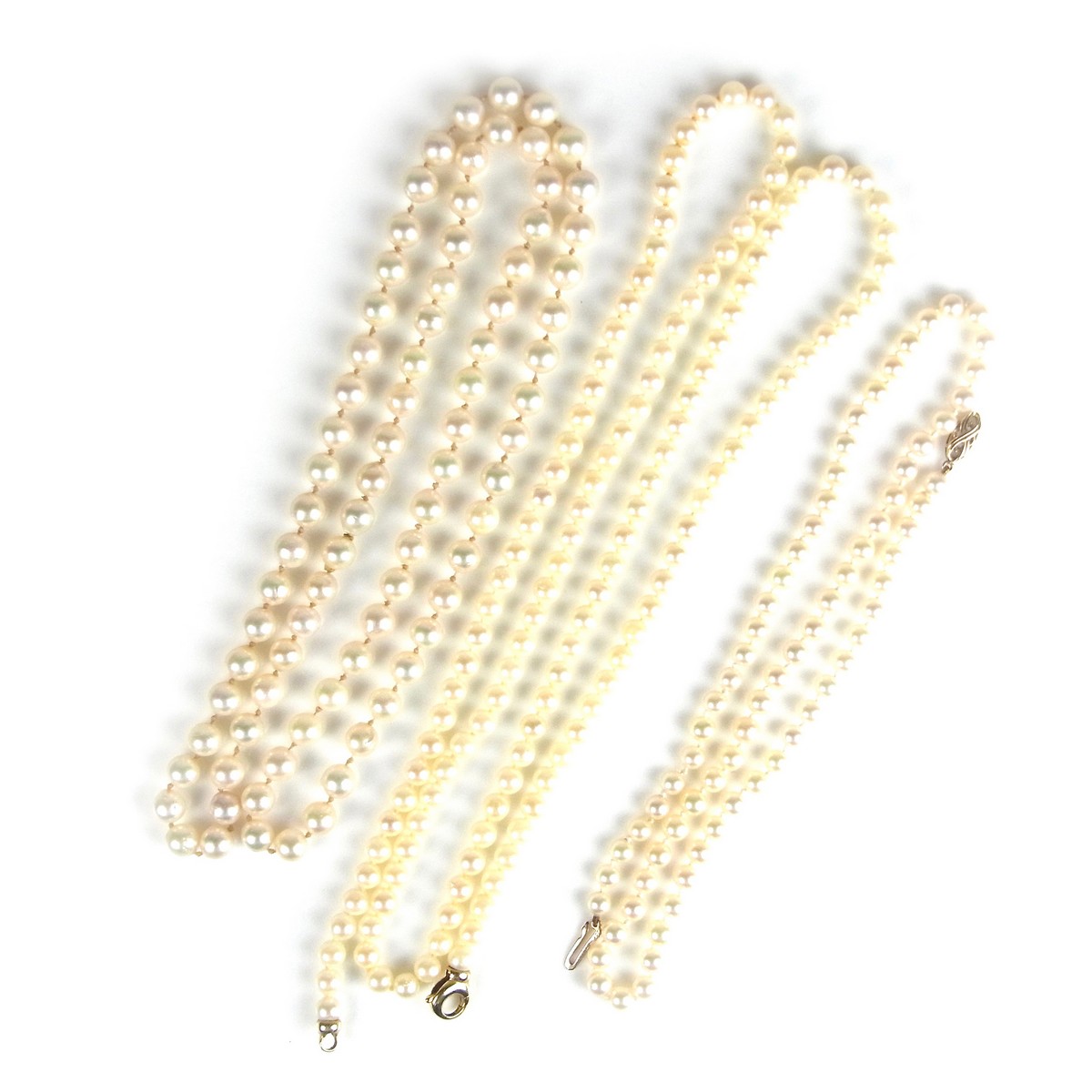 Three pearl necklaces.