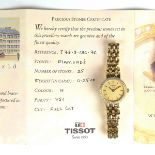 Tissot 18 ct yellow gold lady's diamond set watch.