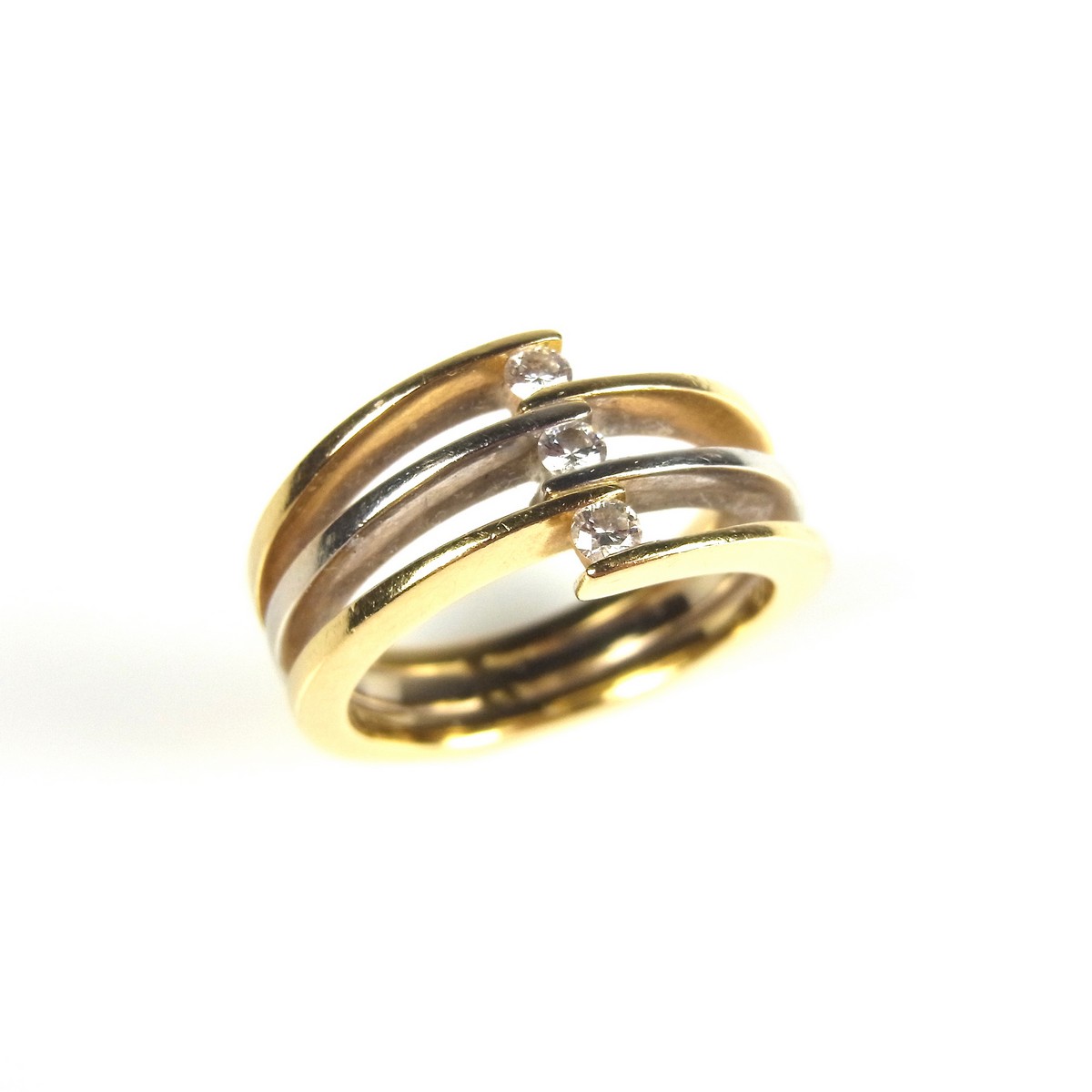 Yellow gold tri-band diamond crossover ring.