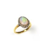 18 ct yellow gold opal and diamond cluster ring.