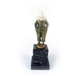 An Art Deco cold painted, gilt bronze and ivory pierrot figure by G Danzmann.