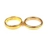 Two 22 ct yellow gold rings.