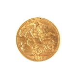 Gold sovereign coin.