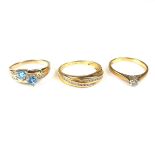 Three yellow gold gem set rings.