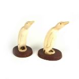 Maritime: A pair of carved scrimshaw penguins.