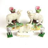 An English pottery figural group of sheep, 19th century and later.
