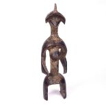 Tribal Art: An African carved wood Mumuye figure, Nigeria, late 19th/early 20th century.