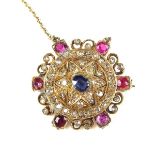 Yellow gold and silver diamond, sapphire and ruby brooch.