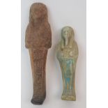 AN EGYPTIAN SHABTI DOLL moulded with hieroglyphs (repaired), 17cm high and another, 13cm high (2)