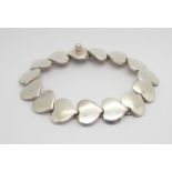 A DANISH SILVER HANS HANSEN HEART BRACELET length 18cm weight 27.4gms Condition Report: Available