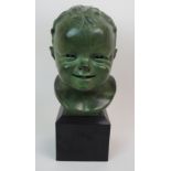 VIOLET MACKENZIE - A BRONZE BUST OF A TODDLER with verdigris patination, signed and dated 1945, 33cm