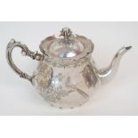 A CHINESE SILVER BALUSTER TEAPOT AND COVER with peach finial, the body decorated with figures at