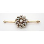 A 14K GOLD OPAL CLUSTER BAR BROOCH the opal cluster diameter is approx 2.1cm, length of the bar