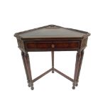 A WARING AND GILLOW MAHOGANY CORNER WRITING TABLE with front twin column legs and single rear leg,