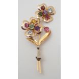 A YELLOW AND WHITE METAL GEM SET FLORAL BROOCH set with a rainbow of natural gemstones, dimensions