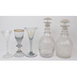 A COLLECTION OF 18TH AND 19TH CENTURY GLASSWARE including a three ring decanter, etched with a
