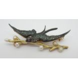 A BRIGHT YELLOW METAL DIAMOND, PEARL AND RUBY SWIFT BROOCH the swift bird fashioned in blued