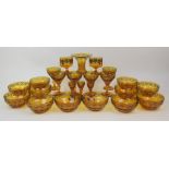 A SUITE OF AMBER FLASHED GLASSWARE with cut to clear decoration of grapes and vines and