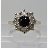 AN 18CT WHITE GOLD SAPPHIRE AND DIAMOND RING diamond content estimated approx 0.50cts, finger size