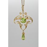 A 15CT GOLD PERIDOT AND PEARL EDWARDIAN PENDANT BROOCH dimensions of the pendant 5.7cm x 3.2cm, with