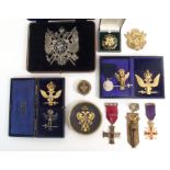 A CASED MASONIC SCOTTISH RITE DOUBLE HEADED EAGLE WHITE METAL BADGE with various other similar