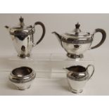 A FOUR PIECE SILVER TEA SERVICE by Walker & Wheeler, London 1959, of tapering cylindrical shape with