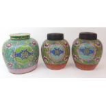 THREE CANTON JARS painted with shou medallions amongst foliage on a yellow ground above a stiff leaf