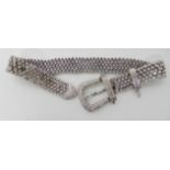 A 14K WHITE GOLD DIAMOND SET BUCKLE SHAPED BRACELET set with estimated approx 6.5cts of brilliant