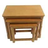 A ROBERT "MOUSEMAN" THOMPSON OAK NEST OF THREE TABLES with octagonal and block legs joined with