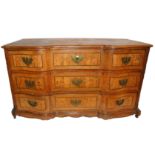 A CONTINENTAL OAK BREAKFRONT CHEST with three drawers inlaid with scrolling cartouches flanked by