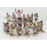 TWO MEISSEN MONKEY BAND FIGURES comprising a trumpet player and a cello player, two female examples,