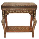 A SYRIAN INLAID GAMES TABLE the hinged top enclosing a baize section above recessed back gammon