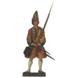 A LARGE LATE 18TH/EARLY 19TH CENTURY CARVED AND PAINTED WOODEN PANEL OF A ROYAL MARINE painted in