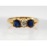 AN 18CT GOLD SAPPHIRE AND DIAMOND RING with Edinburgh hallmarks for 1906, finger size N, weight 3.