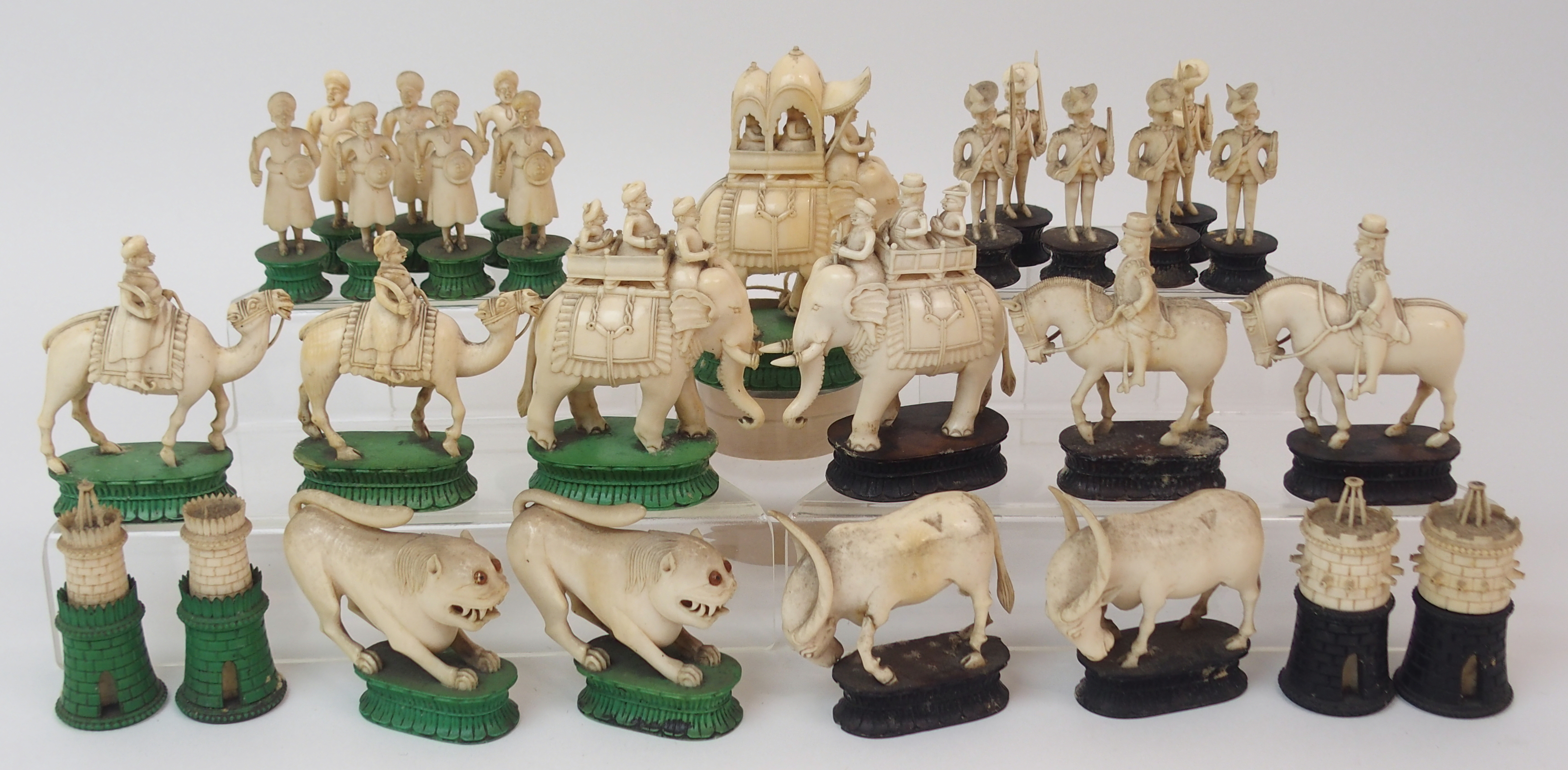 AN EAST INDIAN IVORY CHESS SET probably Berhampore, one set with black stained bases lacking two