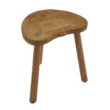 A ROBERT "MOUSEMAN" THOMPSON THREE LEGGED OAK STOOL with kidney shaped top, with signature mouse,
