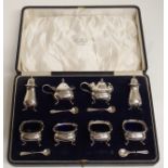 A CASED SILVER CONDIMENT SET by Wilson & Sharp Limited, Birmingham 1923 comprising; four salts, a